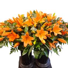Orange lily casket spray 